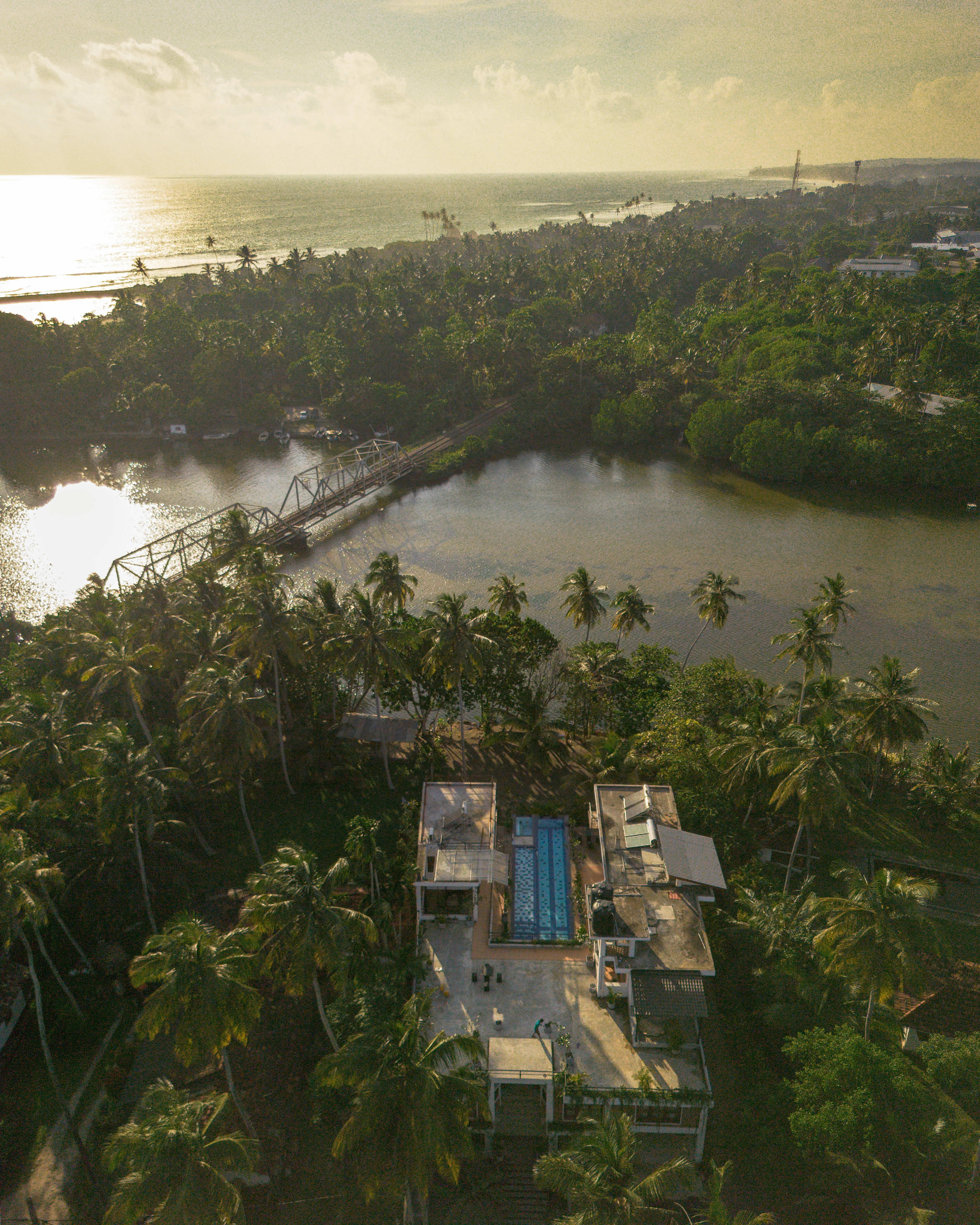 Aerial view of Ko Lake Villa at sunset on Koggala Lake
