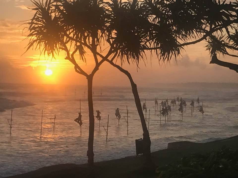 Stilt fishermen at sunset along the south coast near Kabalana and Ahangama